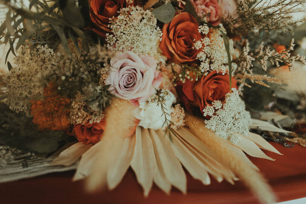Orange, pink and white florals for boho chic elopement