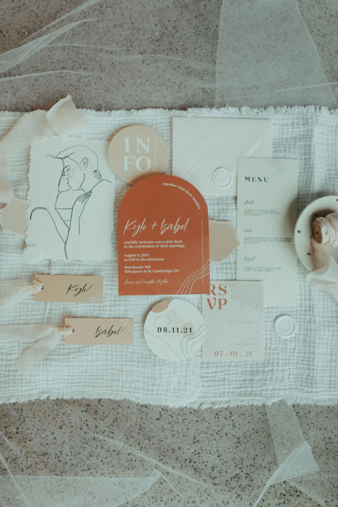 White and orange stationary for boho chic elopement
