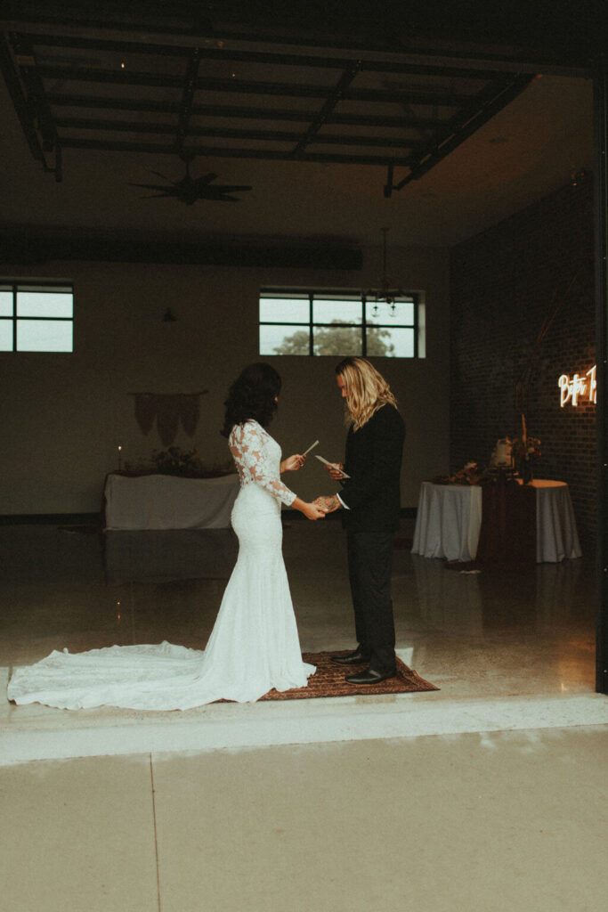 Bride and groom exchange vows during boho chic elopement