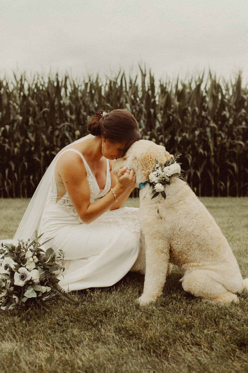Bride and dog with floral collar