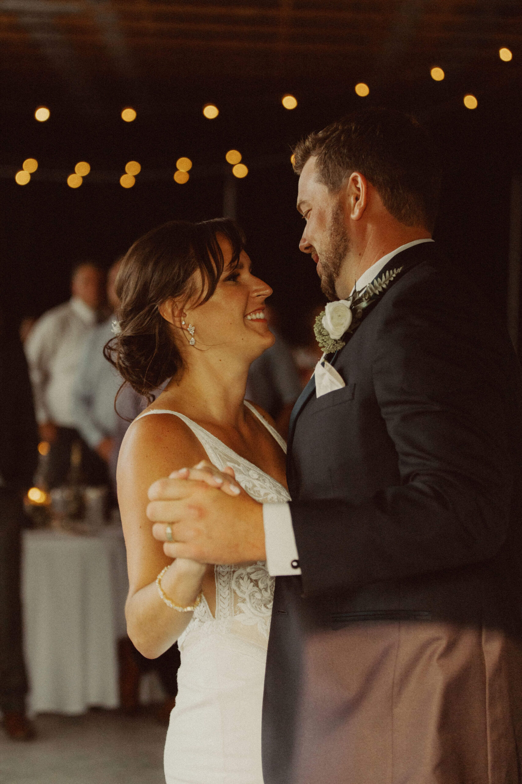 Bride and groom first dance at farm wedding reception