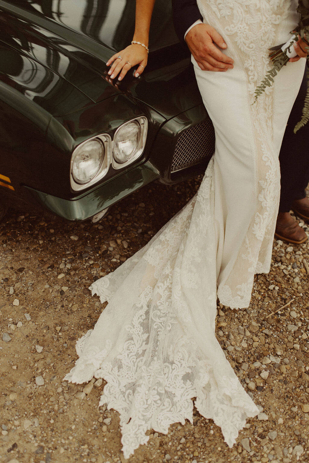 Bride and groom portraits in classic car