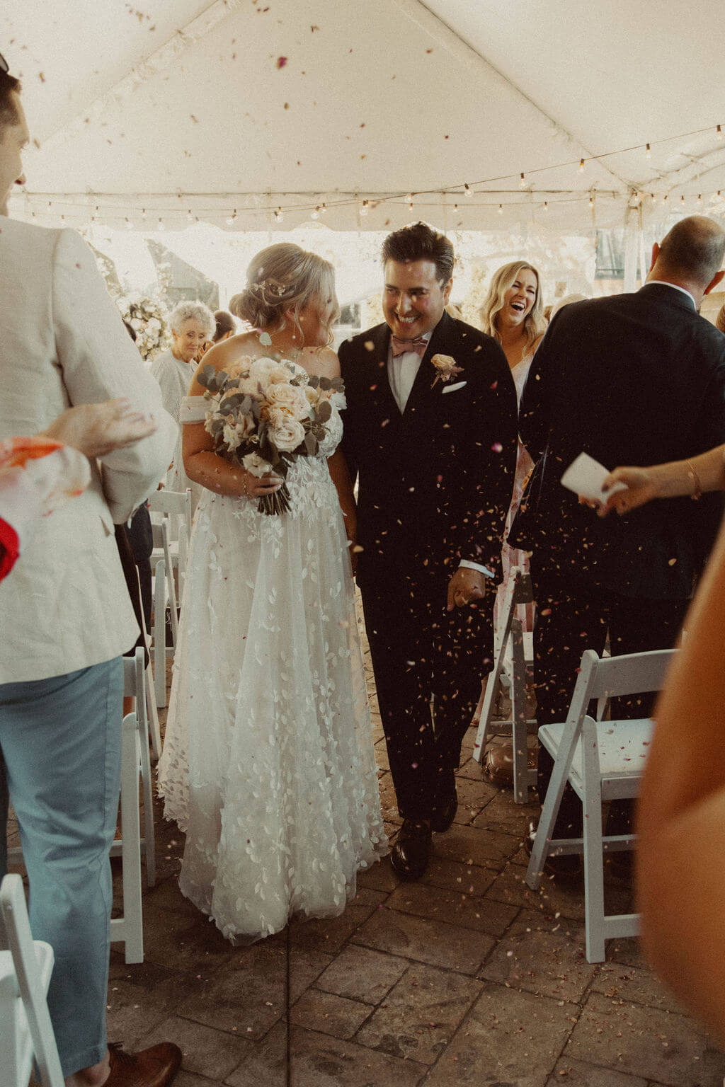 Bride and groom petal exit at intimate wedding in Ontario