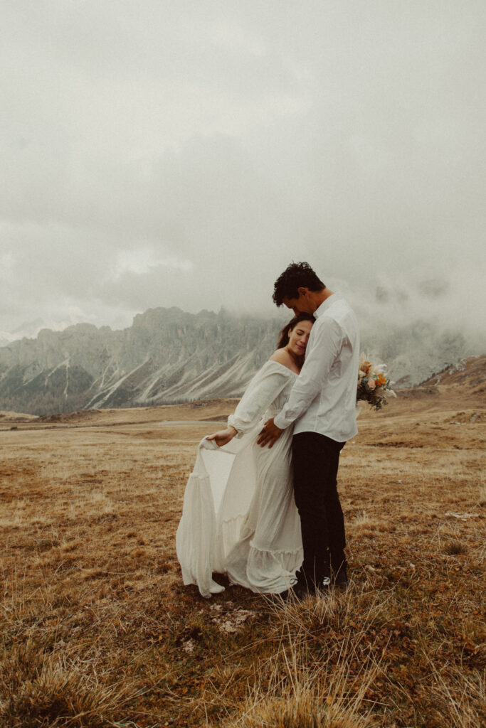A couple standing together after figuring out how to plan a destination wedding in the Dolomites.